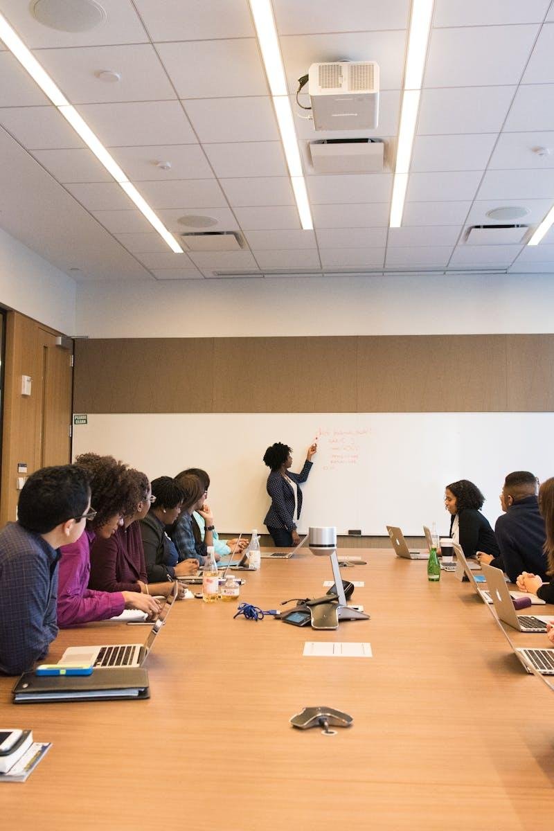 Business meeting with diverse team discussing projects in a modern conference room.