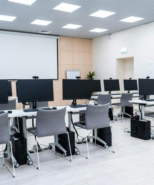 a room filled with lots of computer monitors